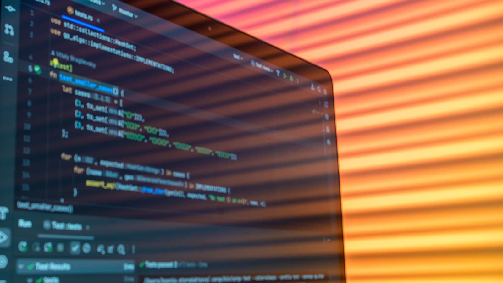 A code editor on screen, illuminated by warm evening light