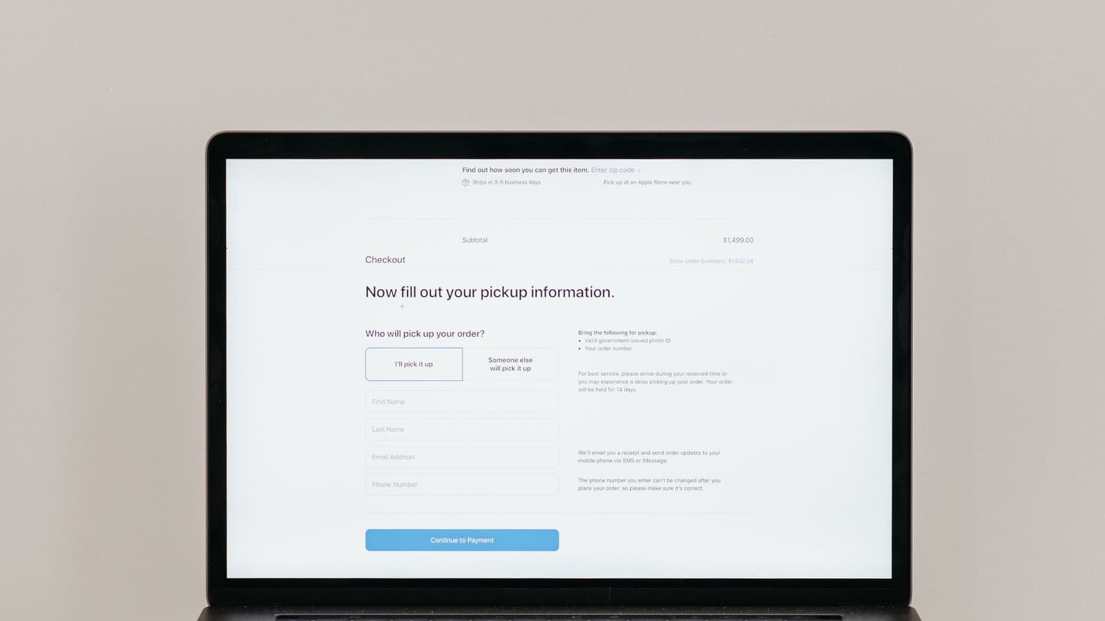 Close-up of a laptop screen showing an outdated website layout