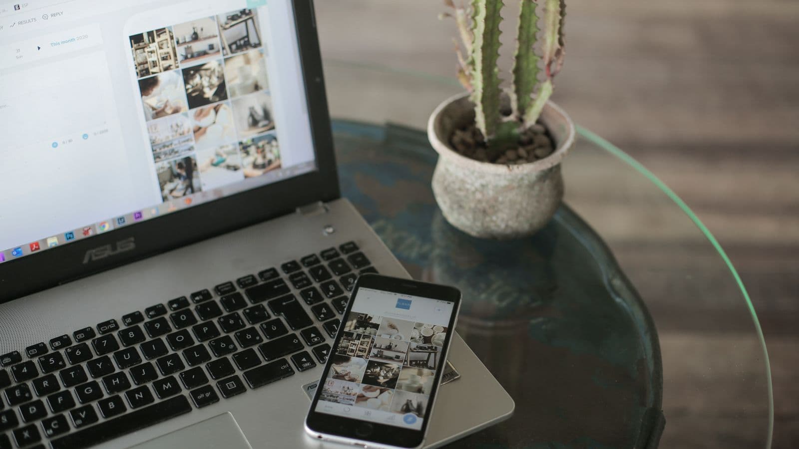 A laptop and smartphone displaying social media apps side by side on a desk