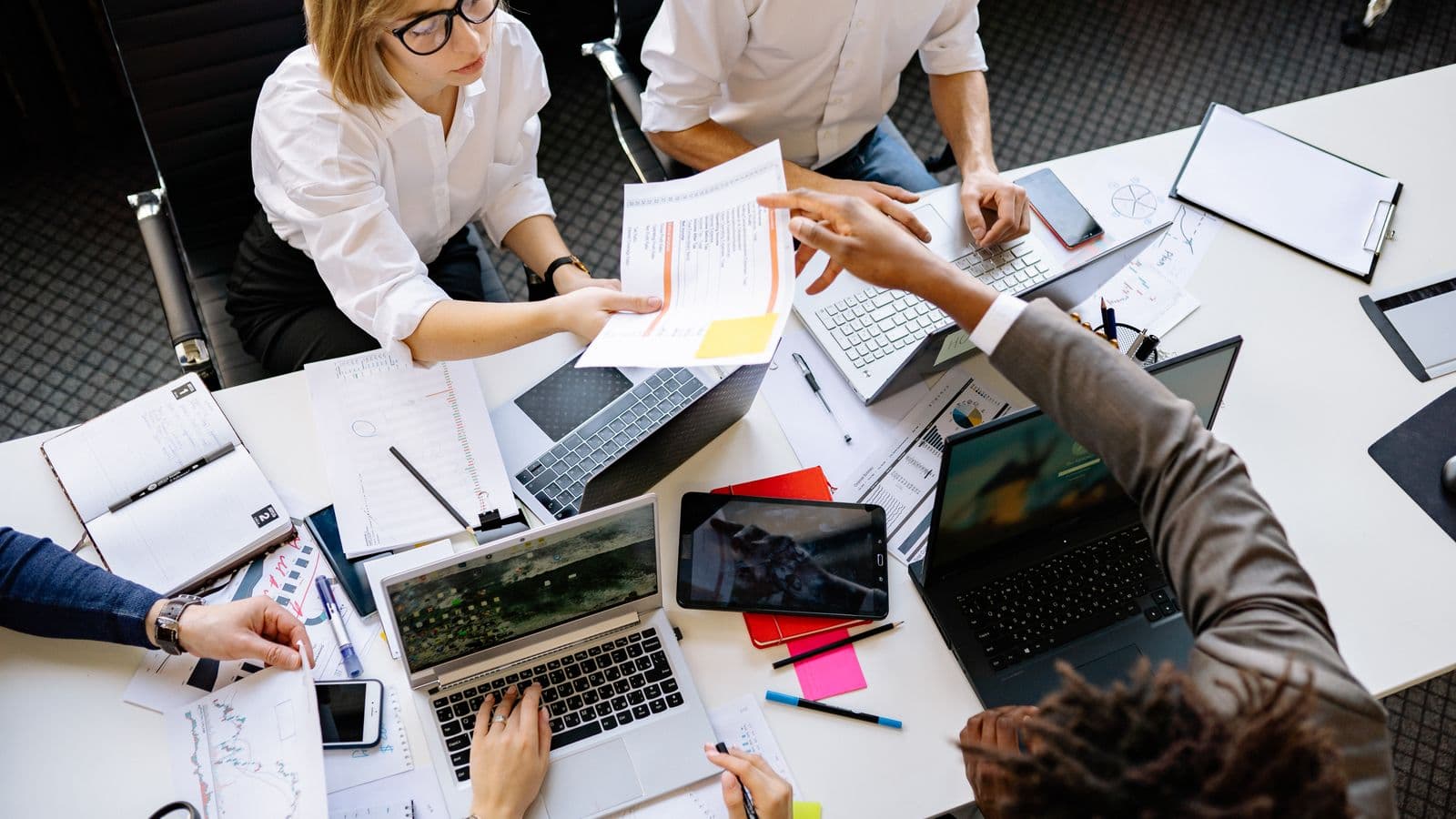 Colleagues collaborating on a project in a modern office